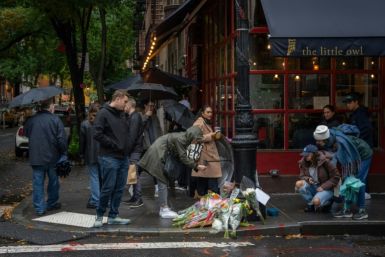Fans left flowers for actor Matthew Perry outside the New York apartment building that was used as the exterior shot for colossally popular TV show 'Friends' on October 29, 2023; Perry was found dead a day earlier in his Los Angeles home