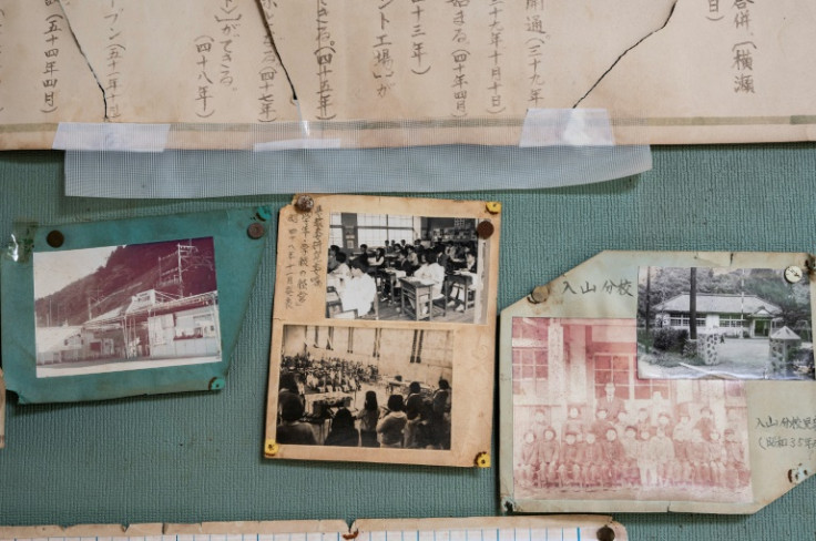 Fading photos of smiling children still adorn the staircase walls at the Ashigakubo primary school