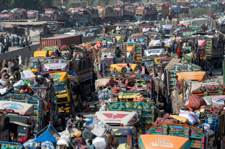 Afghan refugees arrive in trucks at the Afghanistan-Pakistan Torkham border