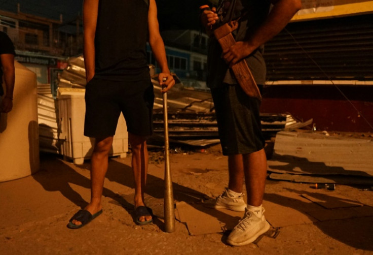 Locals began guarding the streets after a wave of looting hit Acapulco