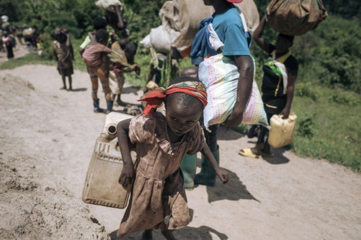 A girl flees from Bambo in eastern DR Congo