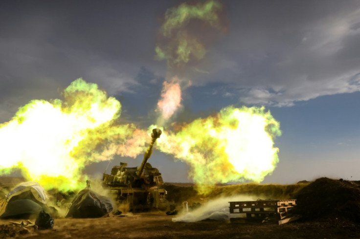 An Israeli artillery unit fires during a military drill in the annexed Golan Heights near the border with Lebanon