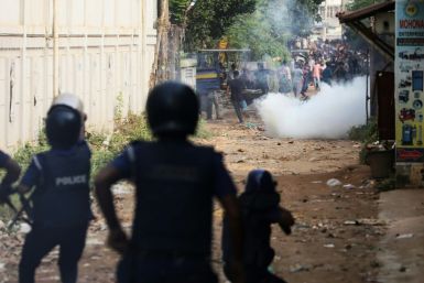 Bangladesh police fire tear gas to disperse striking garment workers in Ashulia who are demanding a near-tripling of their wages to about $209 a month
