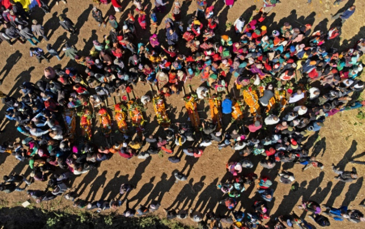 Villagers cremate the bodies of earthquake victims before in Nepal's Chiuri village