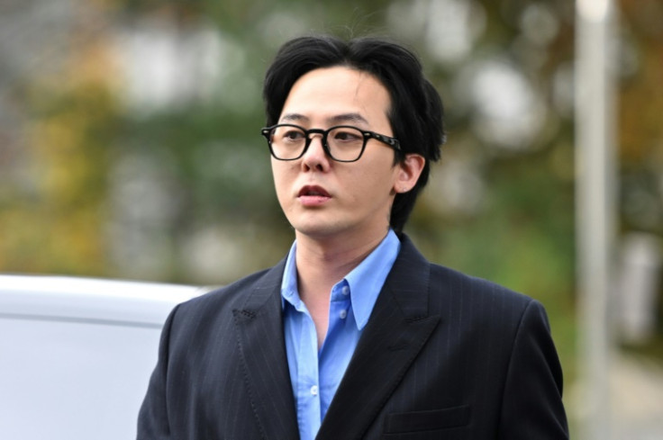 K-pop star G-Dragon arrives at a police station for questioning in Incheon