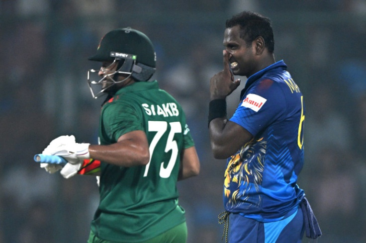 'Disgraceful': Sri Lanka's Angelo Mathews (rifght) watches as Bangladesh captain Shakib Al Hasan takes a run