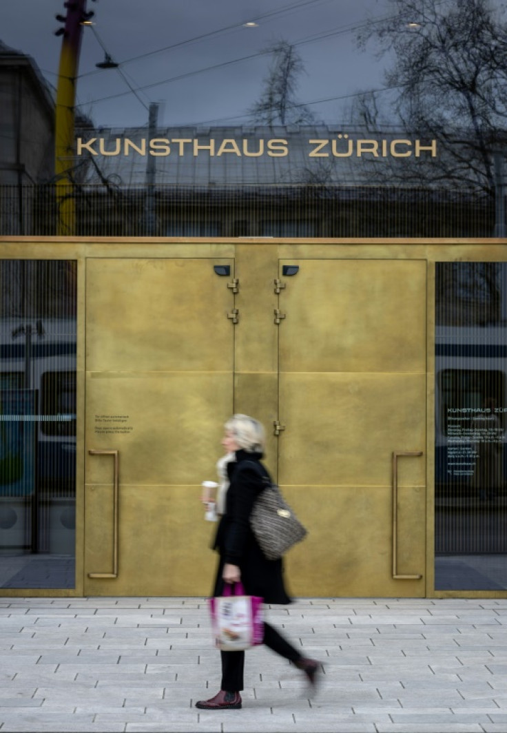 A woman walks past the Kunsthaus Zurich art museum