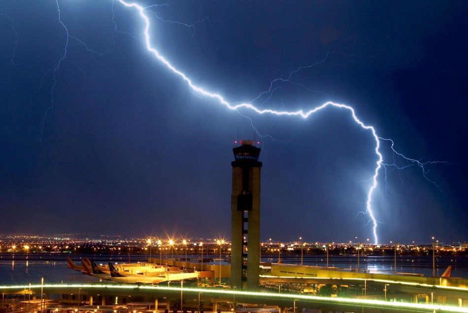 Lightning strikes just south of the McCarran International Airport air traffic control tower in Las Vegas