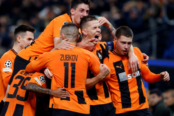 Shakhtar Donetsk players celebrate after Danylo Sikan's goal put them ahead against Barcelona