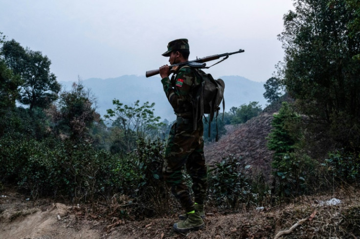 A member of the ethnic rebel group Ta'ang National Liberation Army (TNLA) patrols near Namhsan Township in Myanmar in March this year