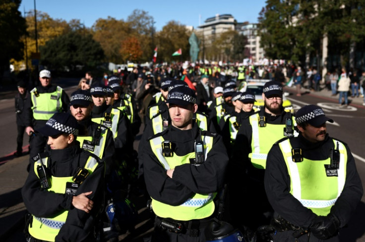 PPolice officer prepare to escort protesters gather in Britain