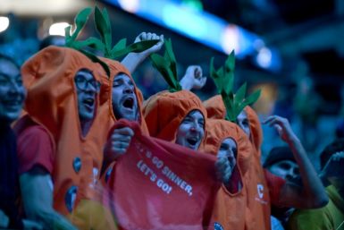 Fans wore carrot costumes in support of Italy's redhead Jannik Sinner