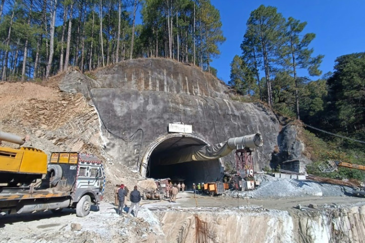 Rescuers in northern India battled for a second day Monday to rescue 40 workers trapped underground
