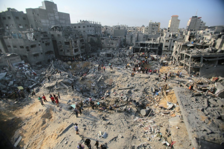 Palestinians assess destruction of an Israeli strike on the Jabalia camp for Palestinian refugees in the Gaza Strip, on November 1, 2023
