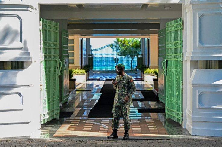 A soldier in the Maldives stands guard outside the president's office in Male on November 13