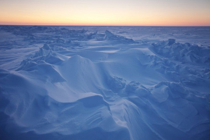The sun sets over Arctic ice