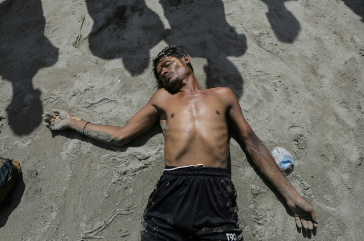 Some made a dart for shore in despair after residents refused their arrival, collapsing to the sand