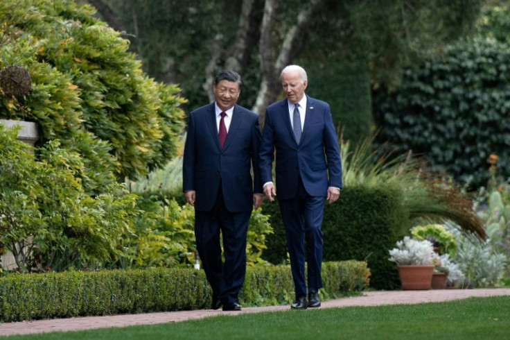 US President Joe Biden and Chinese President Xi Jinping walk together at the Filoli Estate