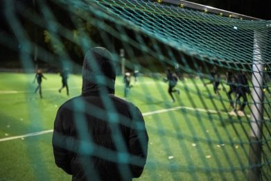Fear: a parent oversees children training at Rinkeby United football club near Stockholm