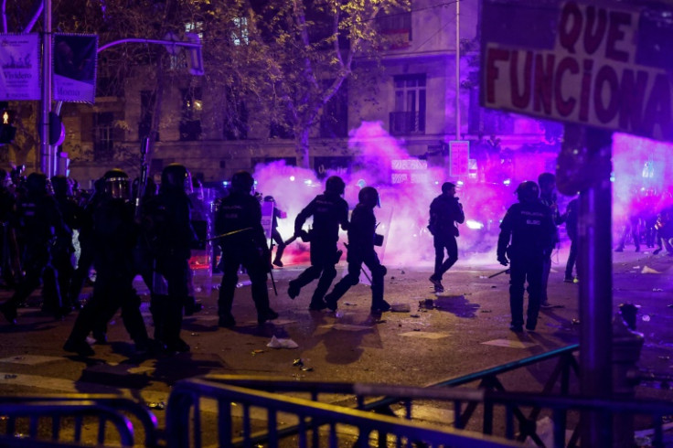 Riot police clash with demonstrators at a protest in Madrid against Sanchez's decision to grant an amnesty to Catalan separatists