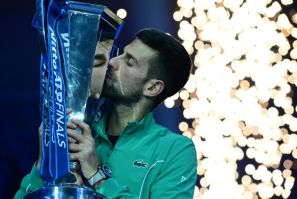 Novak Djokovic celebrates winning the ATP Finals for a record-breaking seventh time