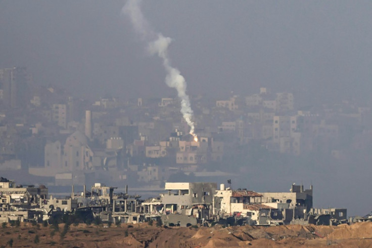 This picture taken from the border with Gaza shows a flare lauched by the Israeli army over the Palestinian territory