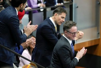 Canadians Michael Kovrig (C) and Michael Spavor (R) appear in Parliament in Ottawa in March 2023