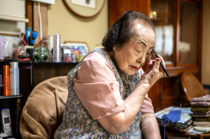 Beauty adviser Tomoko Horino still wears make-up every day, she tells AFP, and maintains a strict beauty regimen every night