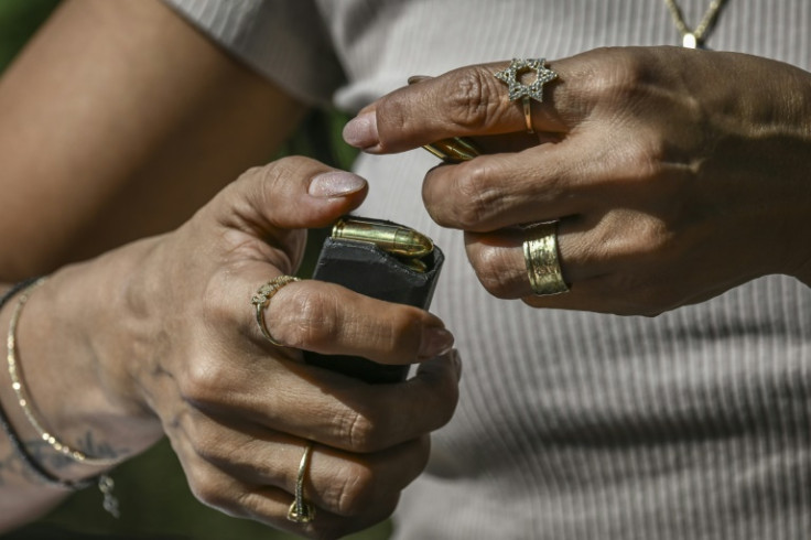 Israeli civilians are rushing to arm themselves after the October 7 attacks.