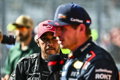 Max Verstappen (R) said a rumoured move by Lewis Hamilton (L) to Red Bull "is not happening"