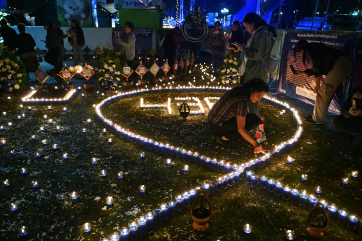 In Guatemala, candles wrote out "438" -- the number of women killed so far this year