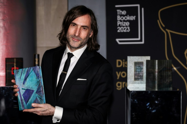 Irish writter Paul Lynch with his 2023 Booker Prize-winning novel 'Prophet Song'