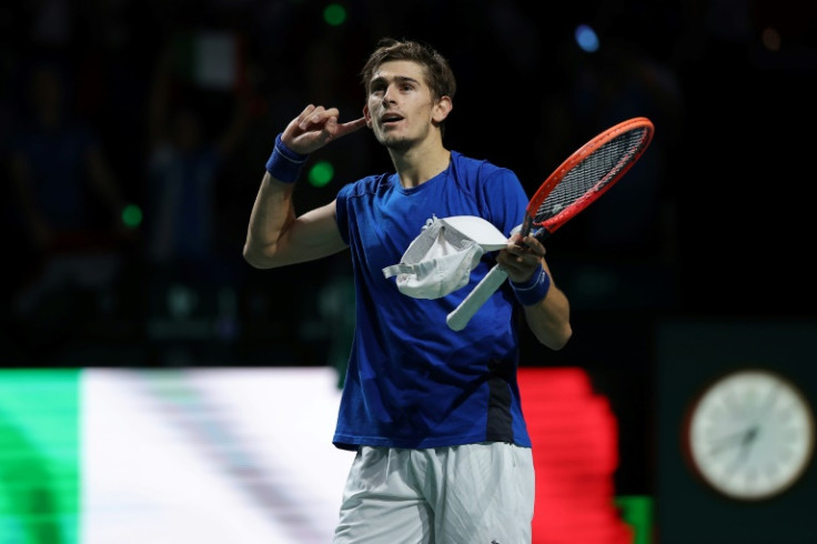 Italy's Matteo Arnaldi celebrates beating Australia's Alexei Popyrin during the first men's singles rubber between Australia and Italy