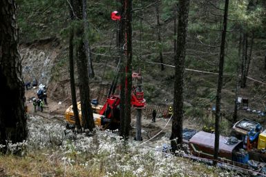 A vertical shaft from the forested hill above the tunnel is also being dug down