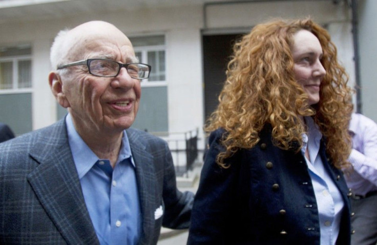 News Corporation CEO Rupert Murdoch leaves his flat with Rebekah Brooks