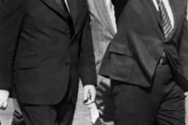 US Secretary of State Henry Kissinger (right) walks next to Israel's foreign minister, Abba Eban, at the Tel Aviv airport in 1973