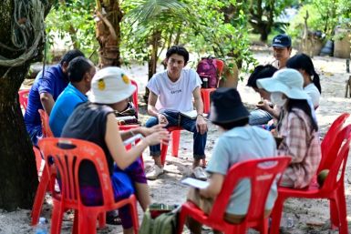 Kino Khanhthamaly (C), an environmentalist working in Laos, takes part in an EarthRights School field trip in the coastal Thai province of Rayong