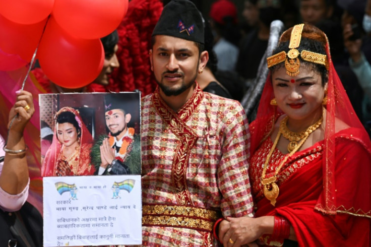 Maya Gurung (R) and Surendra Pandey take part in an August Pride Parade in Kathmandu