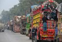 Trucks carrying Afghan refugees in Nowshera, Pakistan