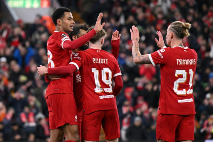 Liverpool striker Cody Gakpo (L) celebrates after scoring against LASK