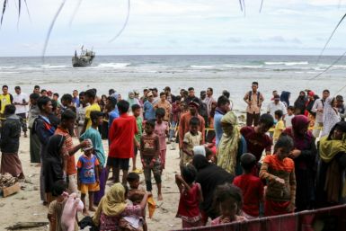 A boat carrying more than 100 Rohingya refugees lands on Sabang island in Indonesia's westernmost Aceh province