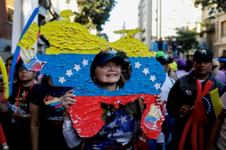 A woman in Caracas shows support for a referendum over the oil-rich Essequibo region, claimed both by Venezuela and Guyana