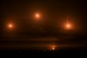 Israeli flares light the sky above Khan Yunis in the southern Gaza Strip