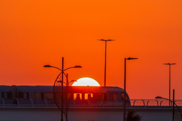 The sun rises at the COP28 climate talks on Wednesday, as negotiators thrash out the thorny issue of planet-heating fossil fuels