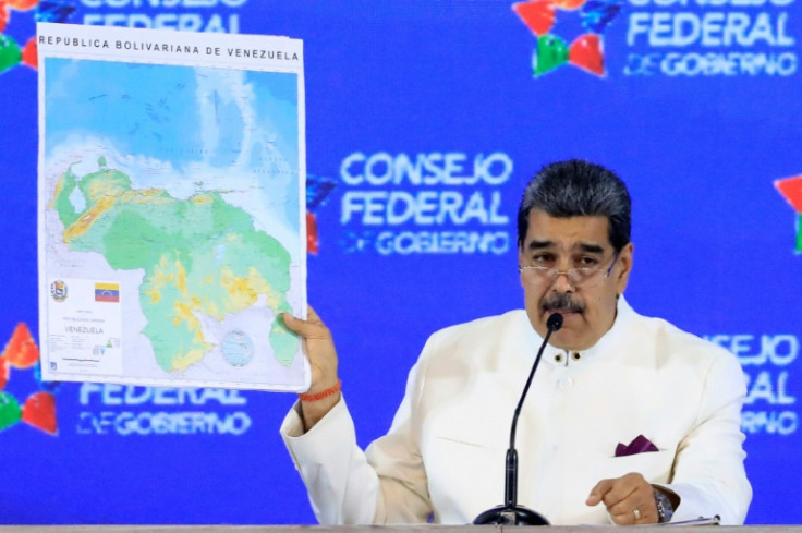 President Nicolas Maduro with a map of the Essequibo region he claims as part of Venezuela