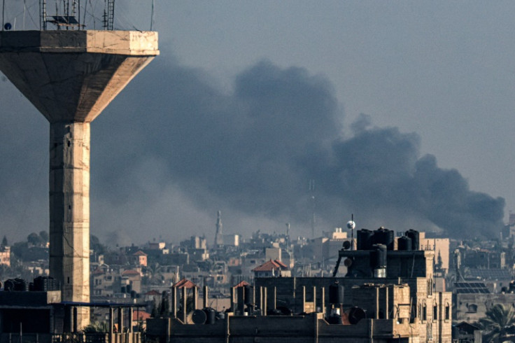 A picture taken from Rafah shows smoke billowing during Israeli bombardment of Khan Yunis