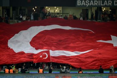Turkey fans wave a giant Turkish national flag during a UEFA Euro 2024 qualifier in October