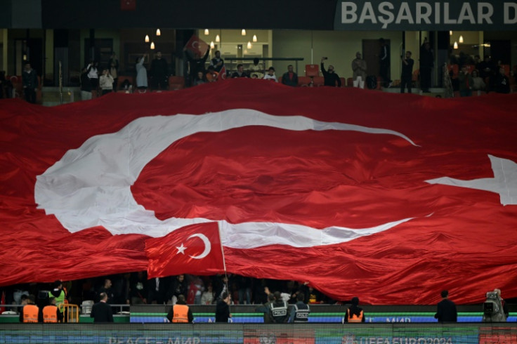 Turkey fans wave a giant Turkish national flag during a UEFA Euro 2024 qualifier in October