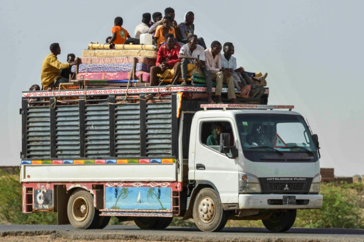 People move on June 22, 2023 along a road from Khartoum to Wad Madani, which became a safe haven until Sudan's war spread into the city and forced a new exodus