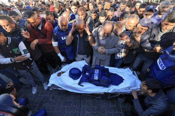 Dozens of journalists took part in a funeral for Al Jazeera cameraman Samer Abu Daqqa
